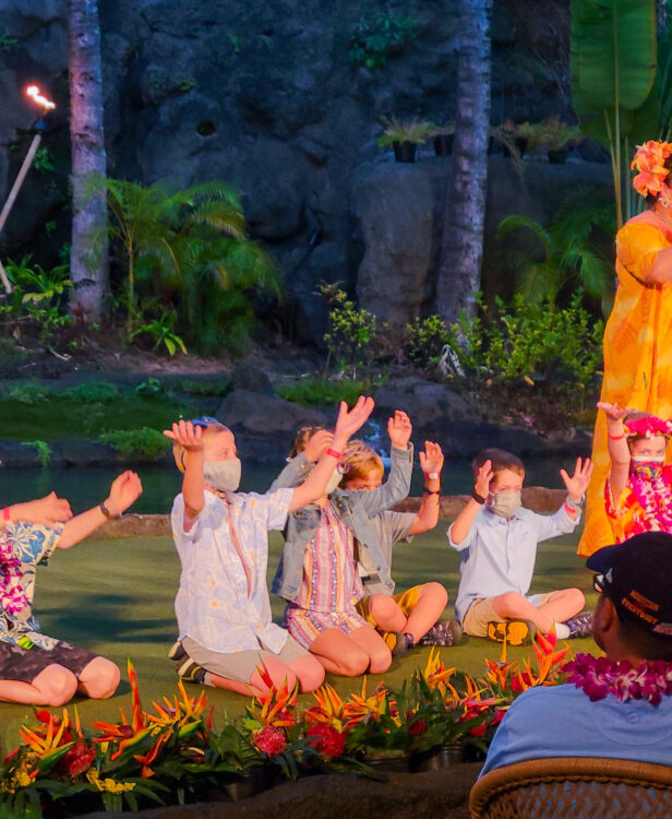 tips for visiting the polynesian cultural center on oahu - kids learning a hula at the luau