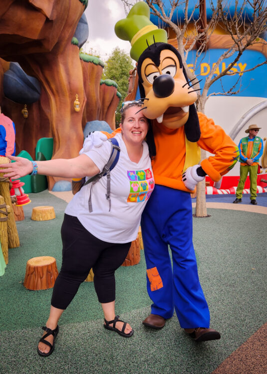 Becca with Goofy in his play yard in Mickey's Toontown.